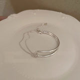 Armband aus Titanstahl mit farbechtem Knoten für Damen im coolen Stil